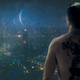 Kovacs looks out over a cityscape on his home planet, Harlan’s World.